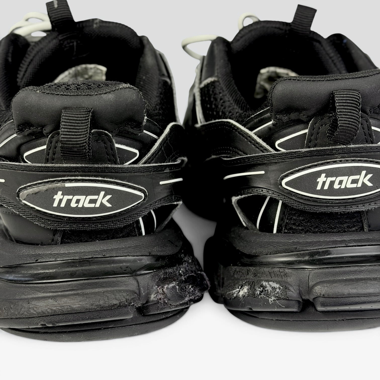 V STEALS Balenciaga Track sneakers in all black featuring technical mesh, layered caging, and rear heel branding.