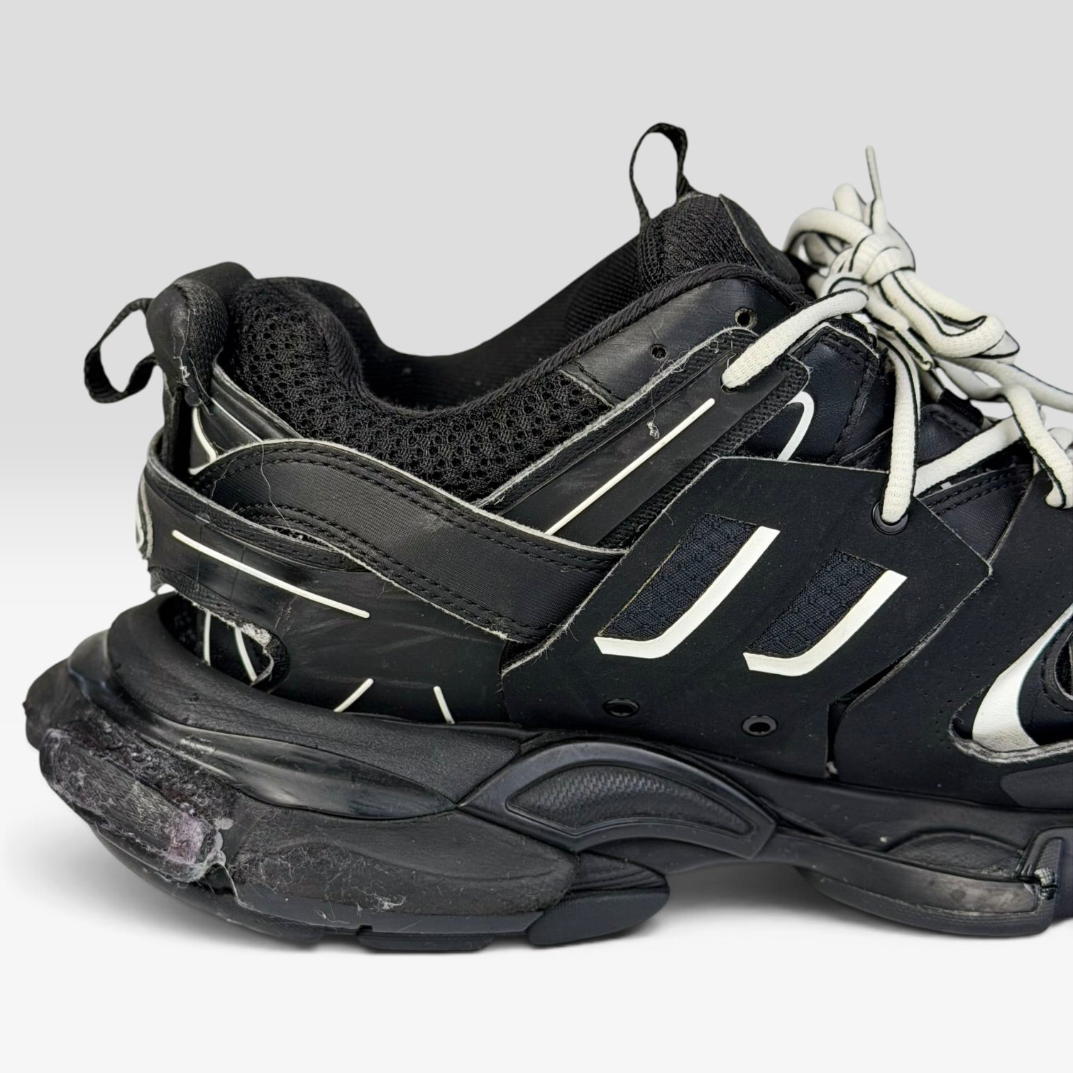 V STEALS Balenciaga Track black chunky sneakers featuring technical mesh, layered caging, and a flared lug sole.