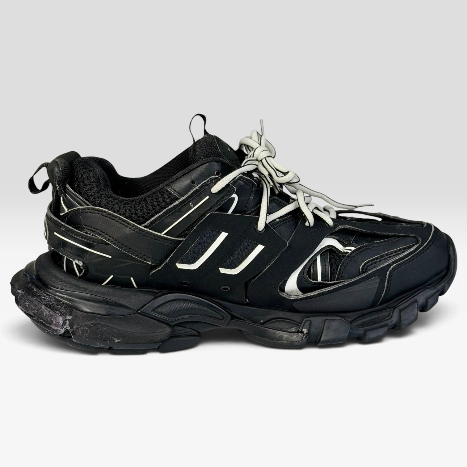 V STEALS Balenciaga Track sneakers in all black featuring a technical mesh upper, layered caging, and chunky sole.