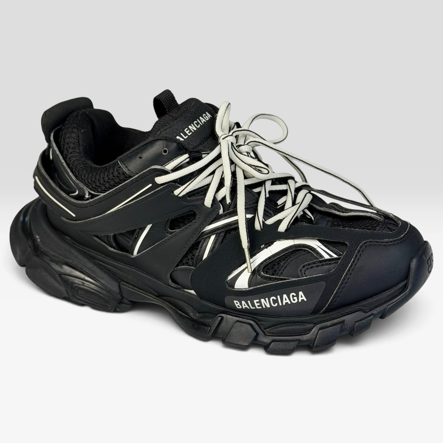 V STEALS Balenciaga Track sneakers in all black featuring technical mesh, layered caging, and a chunky lug sole.