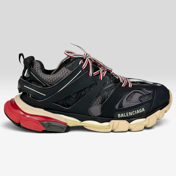 V STEALS Balenciaga Track Bred sneakers in black and red with technical mesh, layered caging, and a chunky lug sole.