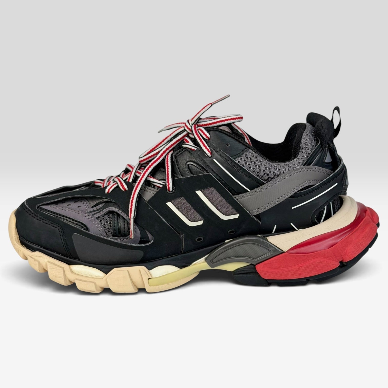 V STEALS Balenciaga Track Bred sneakers in black and red technical mesh with a chunky lugged sole and flared heel.