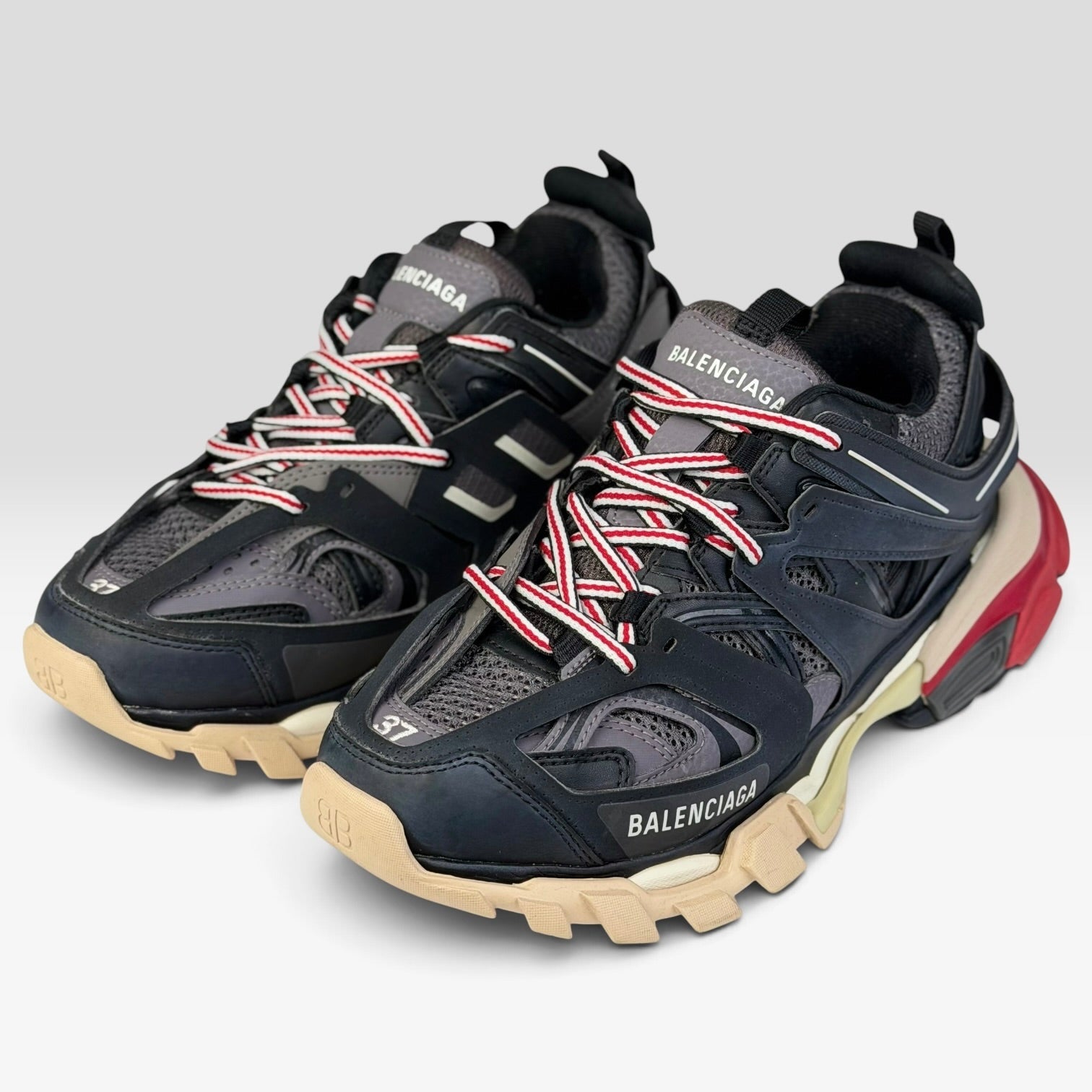 V STEALS Balenciaga Track Bred sneakers in black and red technical mesh with a chunky lug sole and size 37 label.