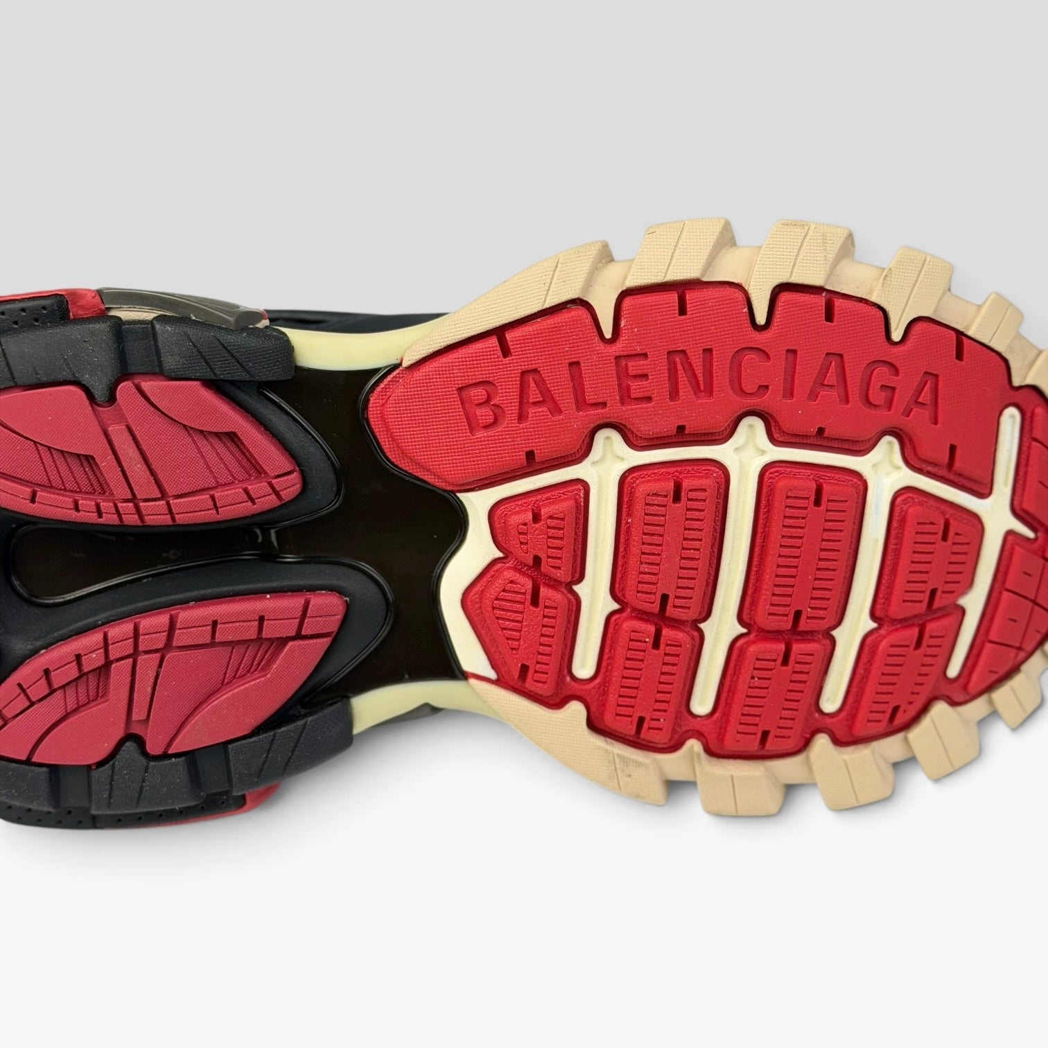 V STEALS Balenciaga Track Bred sneaker sole with red and black lugged rubber tread and embossed logo branding