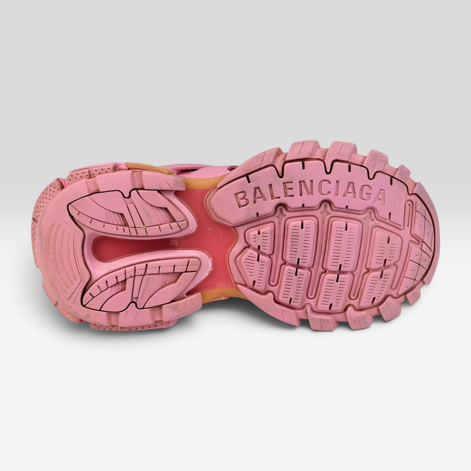 V STEALS Balenciaga Track sneaker in monochromatic pink showing the lugged rubber outsole with embossed branding.