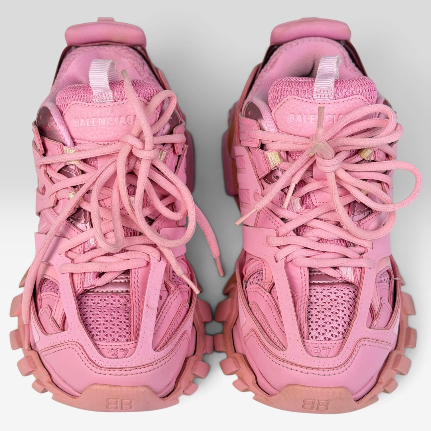 V STEALS Balenciaga Track sneakers in monochromatic pink with technical mesh, synthetic overlays, and lugged soles.