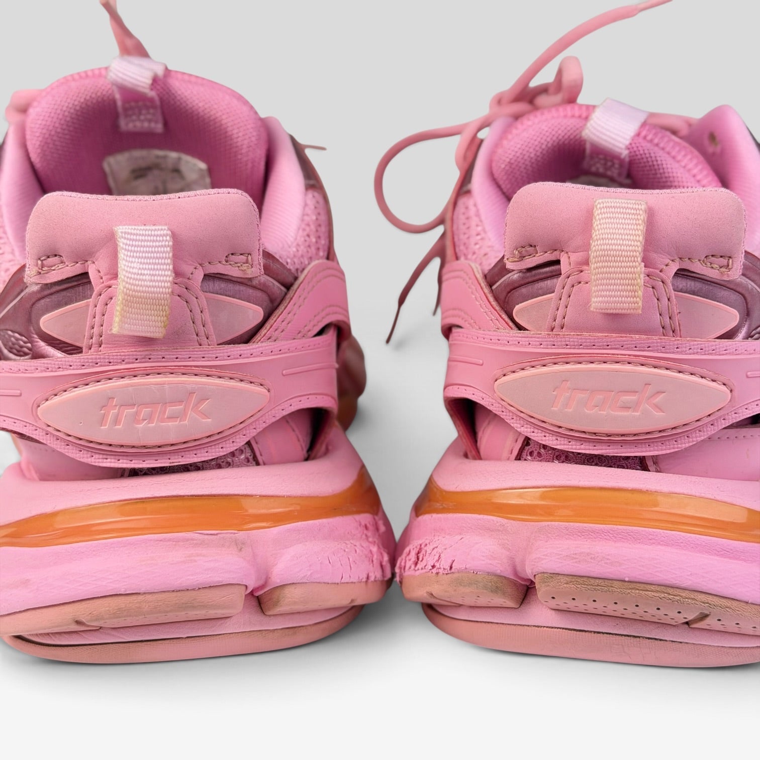 V STEALS Balenciaga Track sneakers in monochromatic pink with layered mesh and synthetic overlays, rear view.