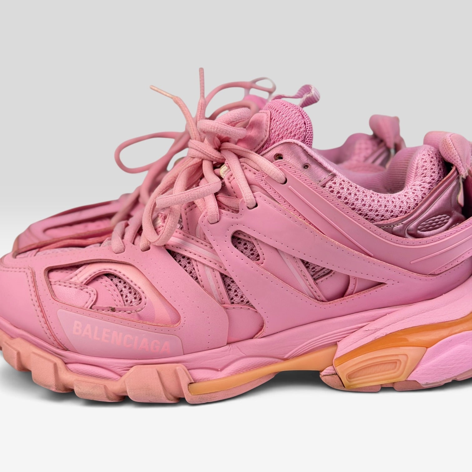 V STEALS Balenciaga Track sneakers in monochromatic pink featuring technical mesh, synthetic overlays, and lug sole.