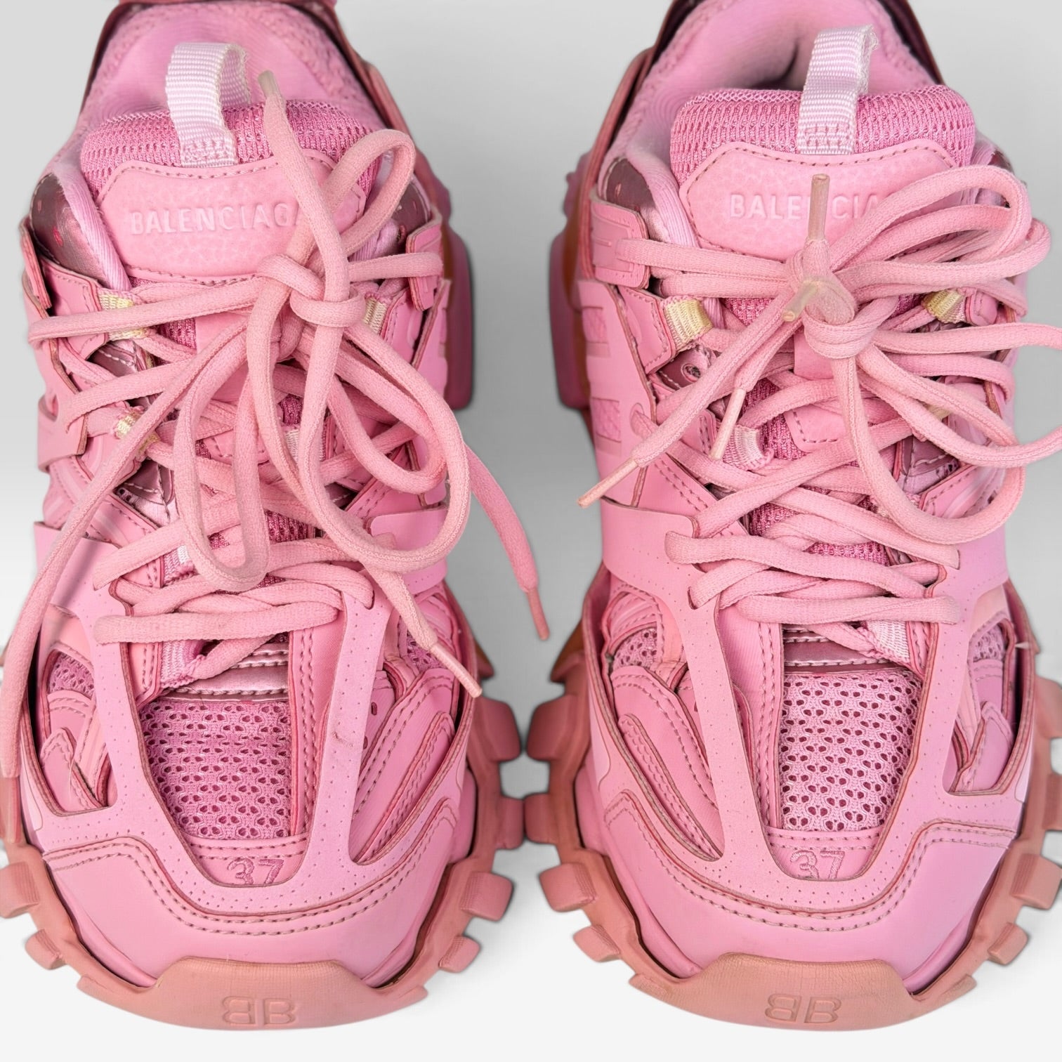 V STEALS Balenciaga Track sneakers in monochromatic pink featuring multilayered mesh and synthetic cage design