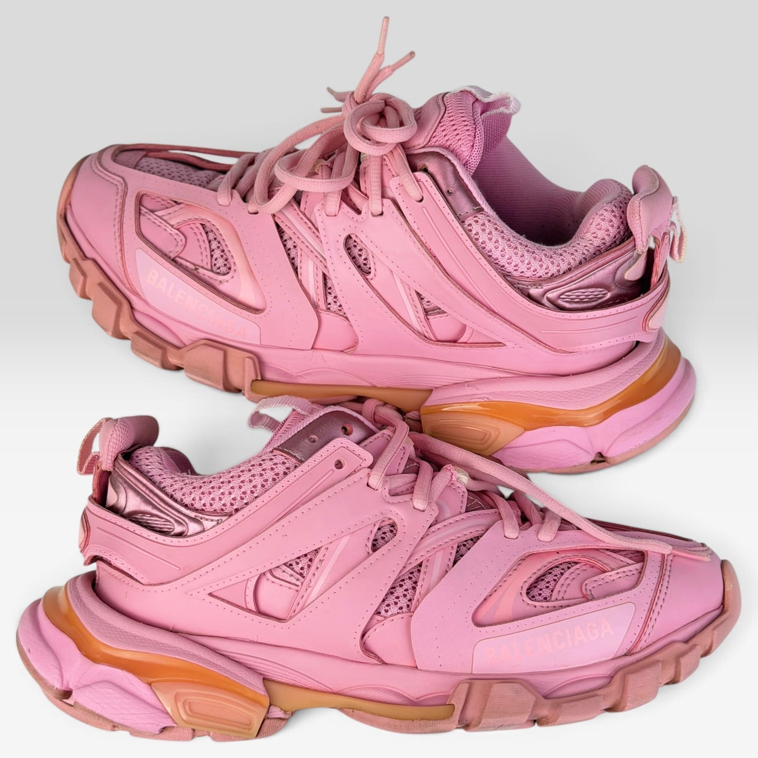 V STEALS Balenciaga Track sneakers in monochromatic pink featuring technical mesh, layered caging, and lug soles.