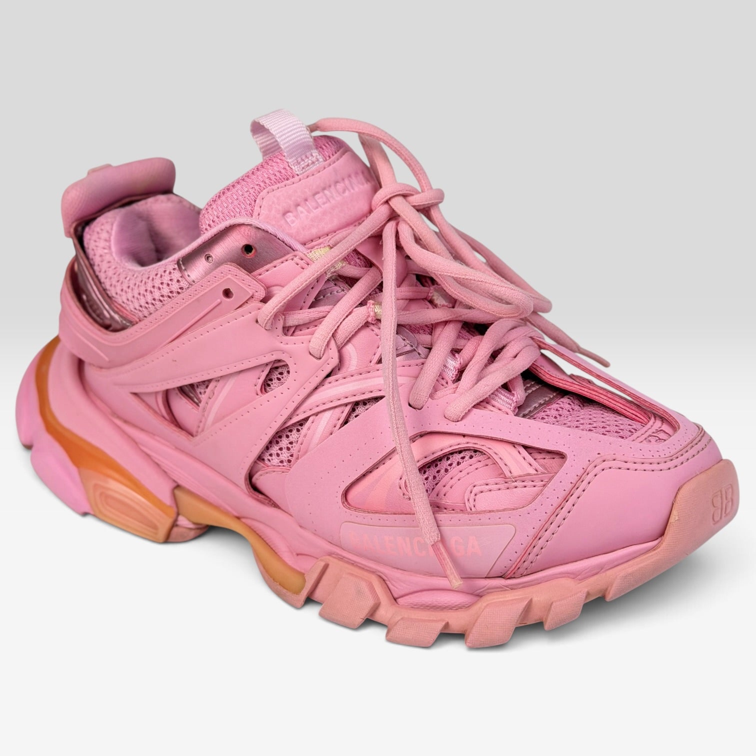 V STEALS Balenciaga Track sneakers in monochromatic pink featuring technical mesh, layered caging, and lugged soles.