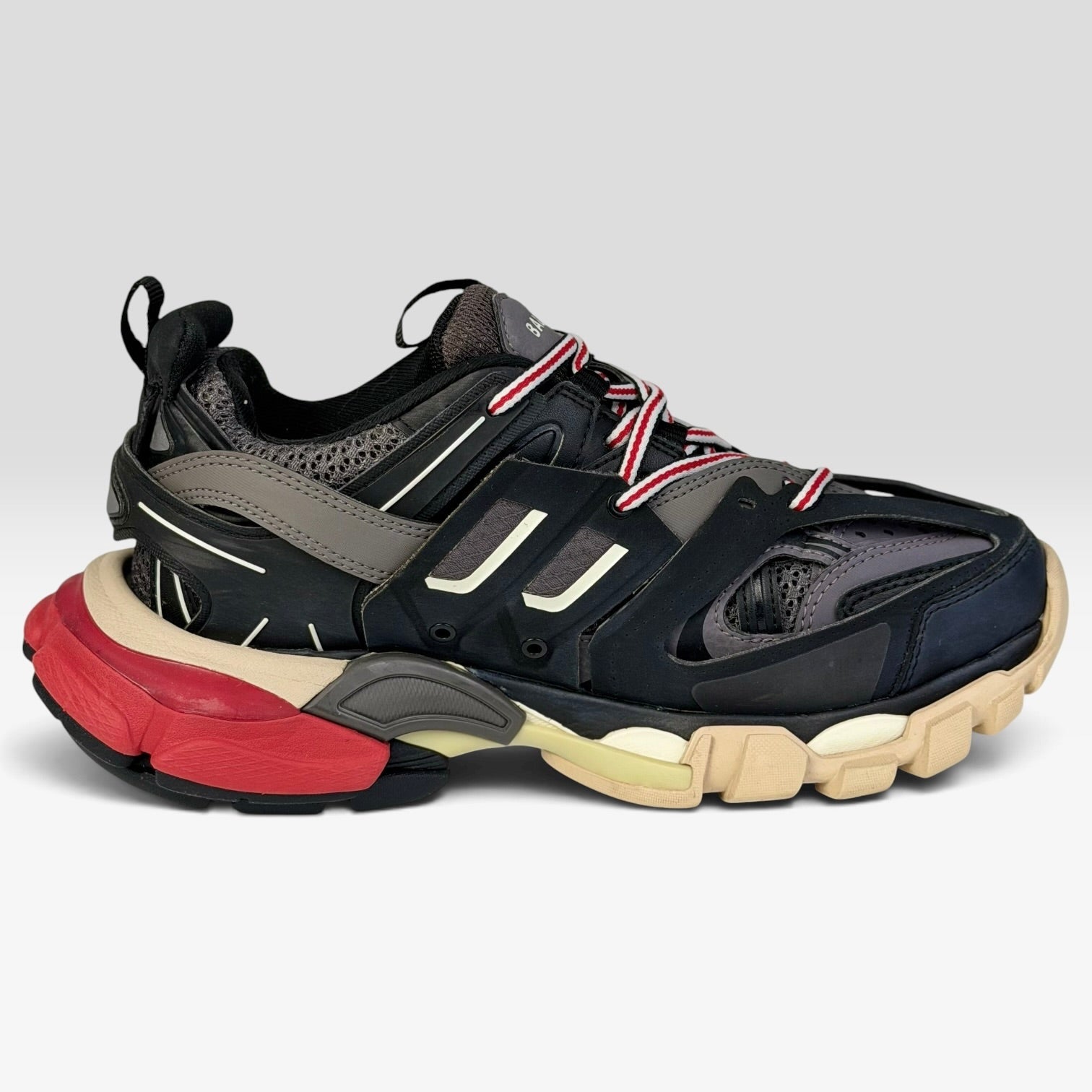 V STEALS pre-loved Balenciaga Track sneakers in black, red, and beige with technical mesh and layered cage design.