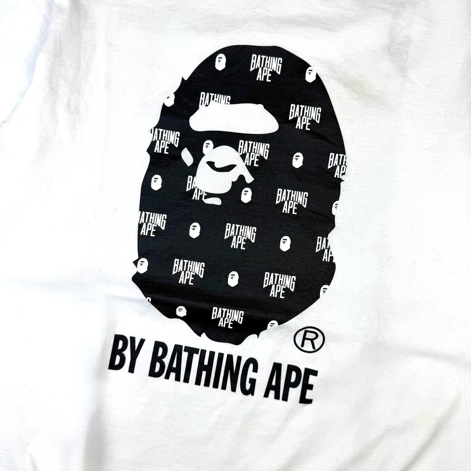 V STEALS white cotton BAPE t-shirt featuring a black Ape Head logo filled with a repeating Bathing Ape monogram pattern