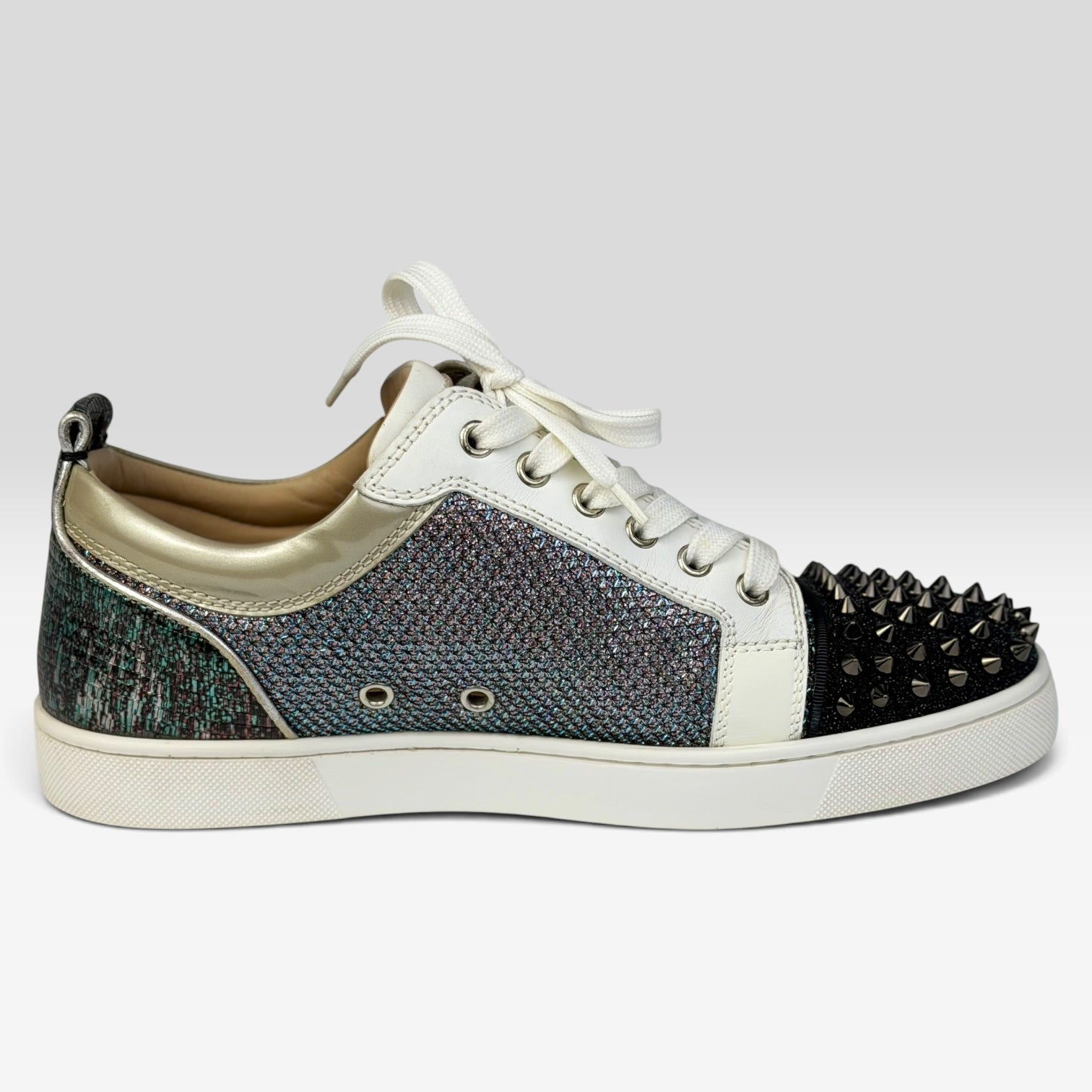 V STEALS Christian Louboutin Louis Junior sneakers with multicolor glitter, lizard-embossed leather, and silver spikes.