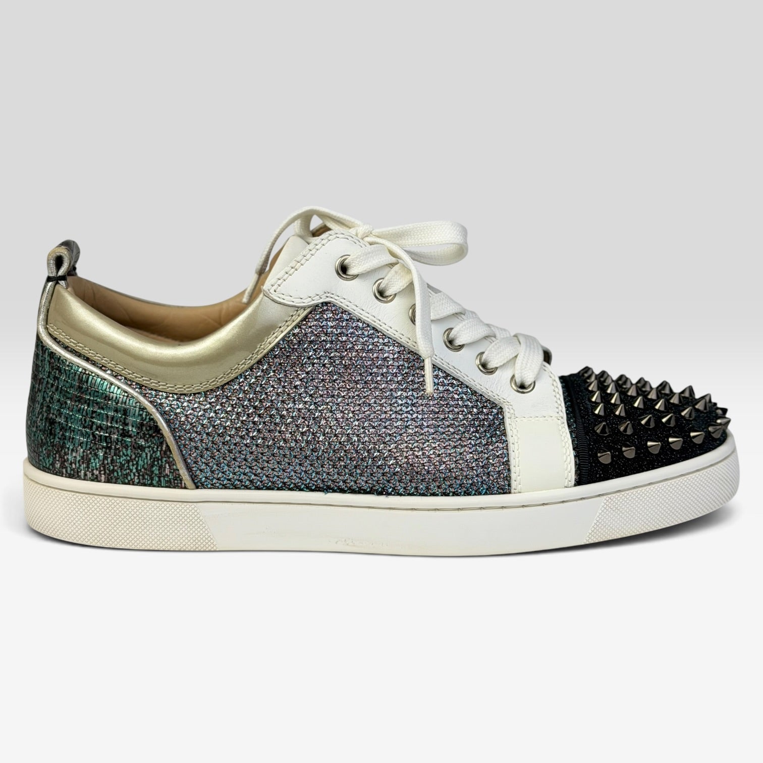 V STEALS Christian Louboutin Louis Junior sneakers with multicolor glitter, lizard-embossed leather, and silver spikes.