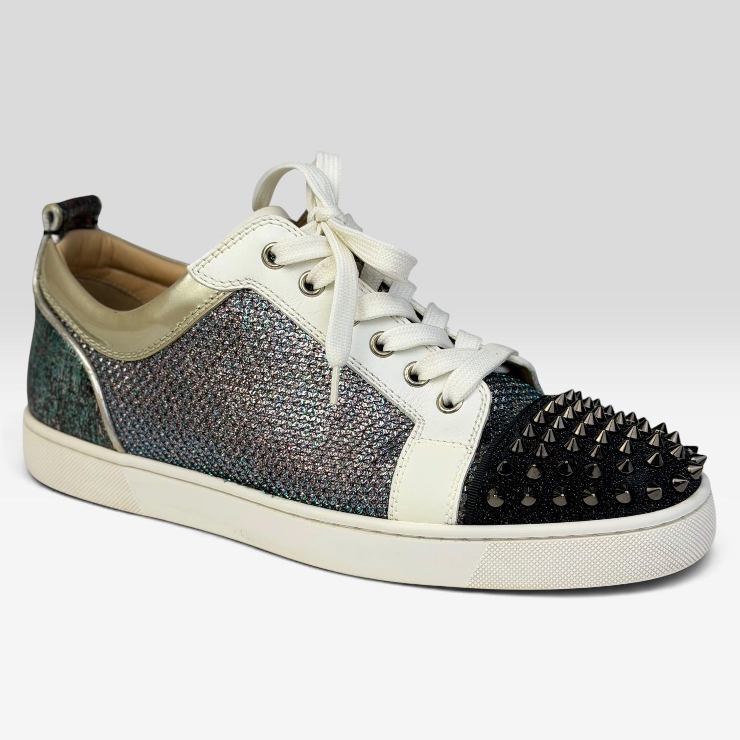 V STEALS Christian Louboutin Louis Junior sneakers with multicolor glitter, lizard-embossed leather, and silver spikes.