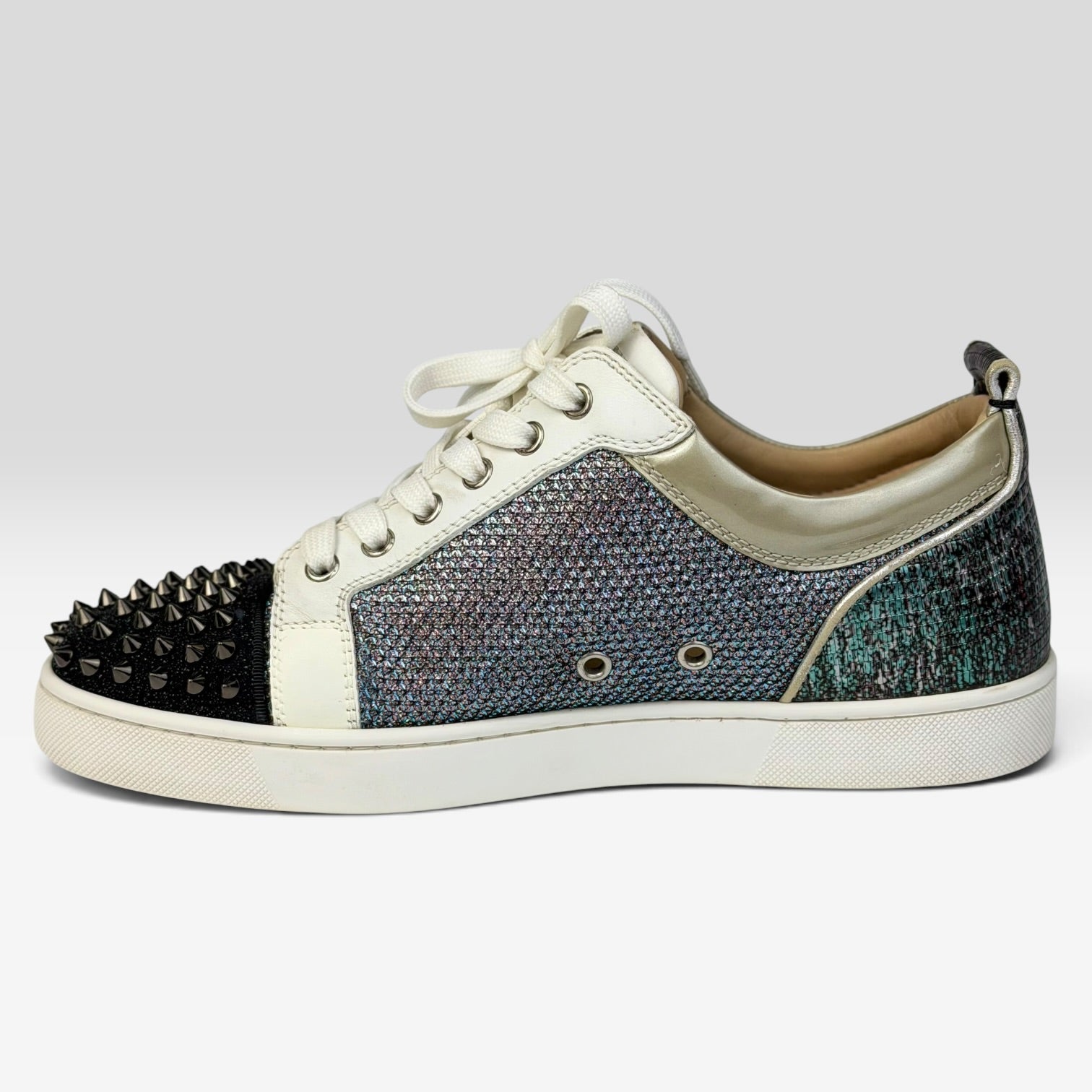 V STEALS Christian Louboutin Louis Junior sneakers with multicolor glitter, lizard-embossed leather, and silver spikes.