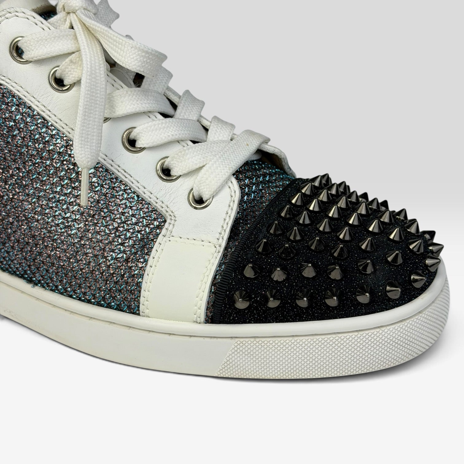 V STEALS Christian Louboutin Louis Junior sneakers featuring multicolor glitter, lizard embossed leather, and spikes.