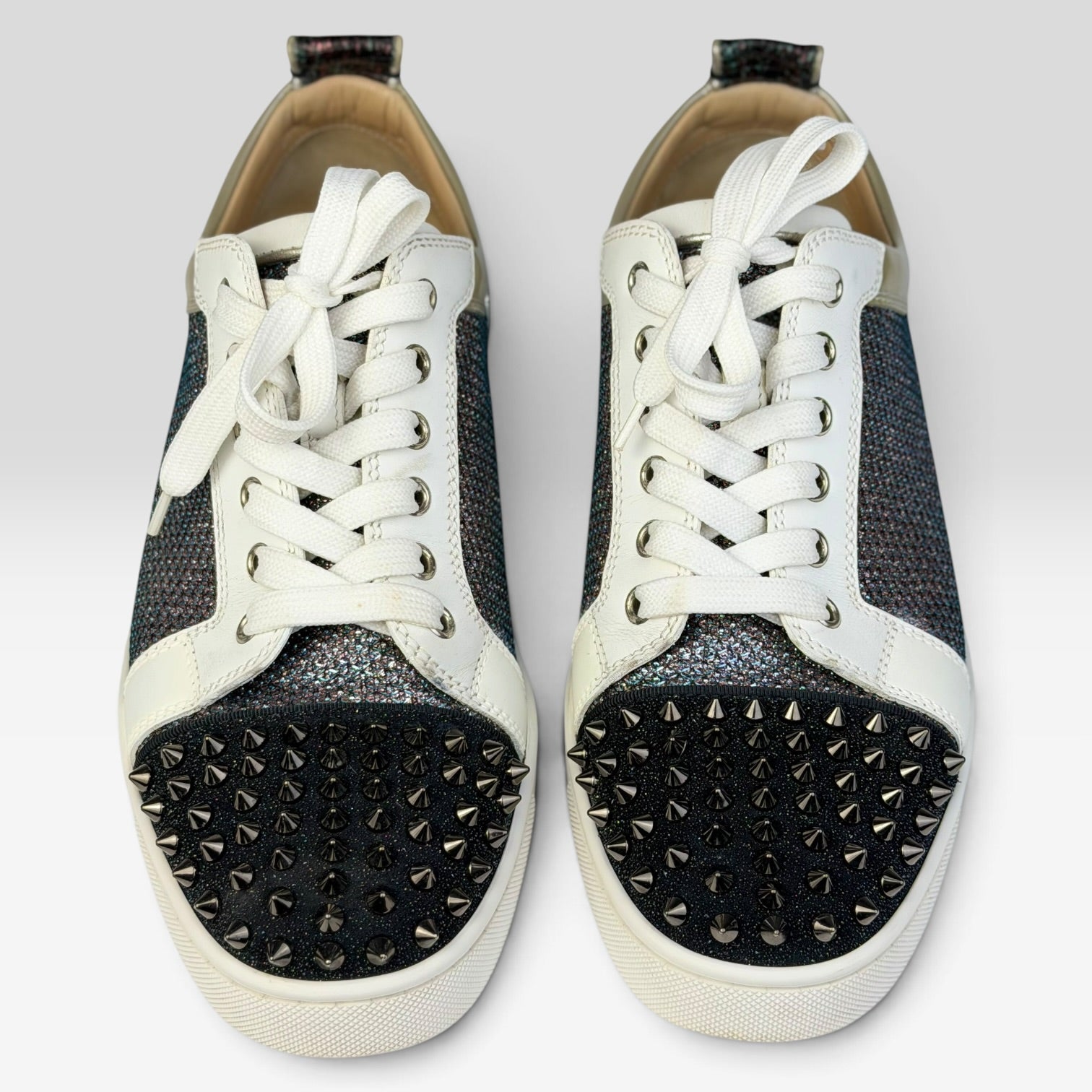 V STEALS Christian Louboutin Louis Junior sneakers featuring multicolor glitter, lizard embossed leather, and spikes.