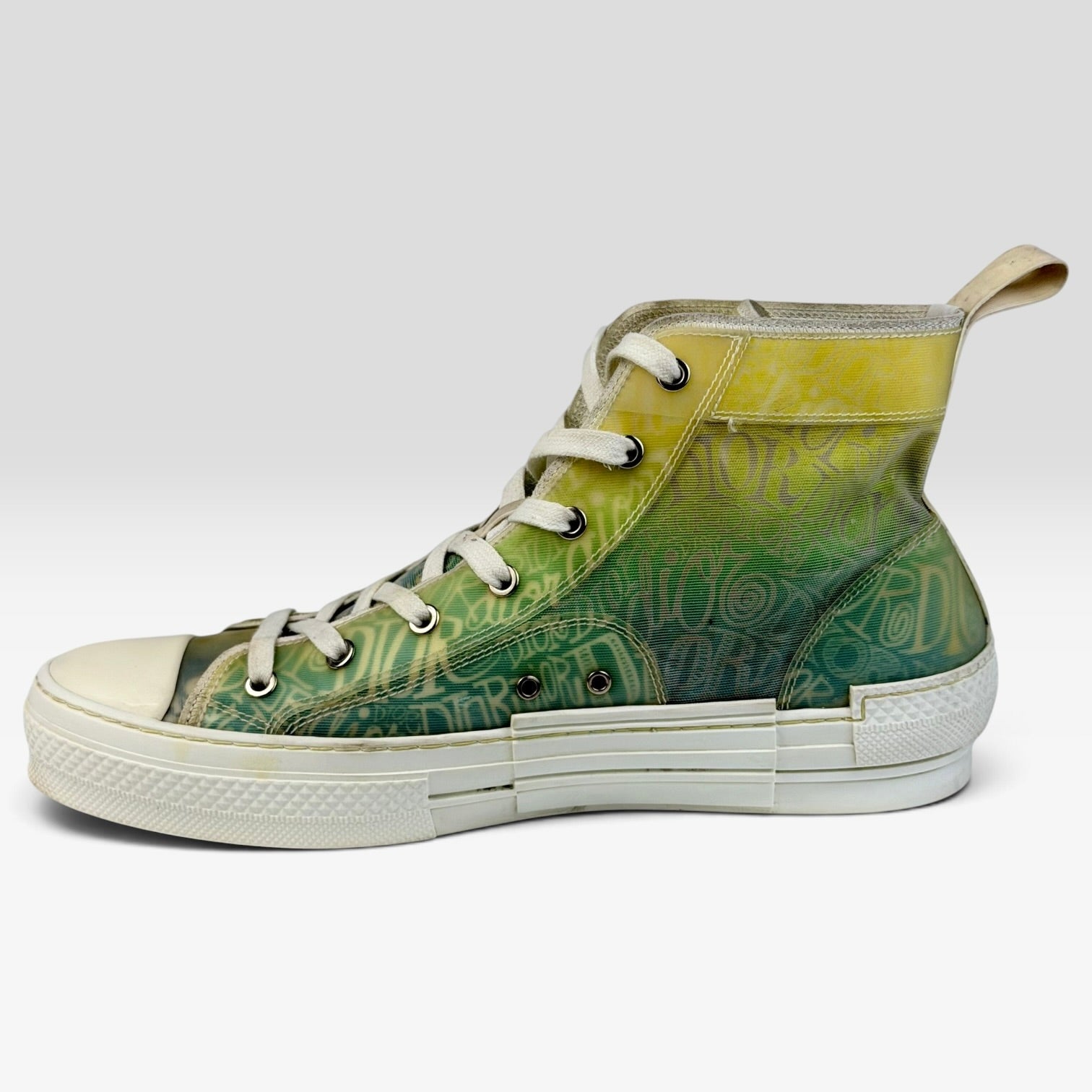 V STEALS Dior x Shawn Stussy B23 high-top sneaker in multicolor canvas with iconic graffiti print and rubber sole.