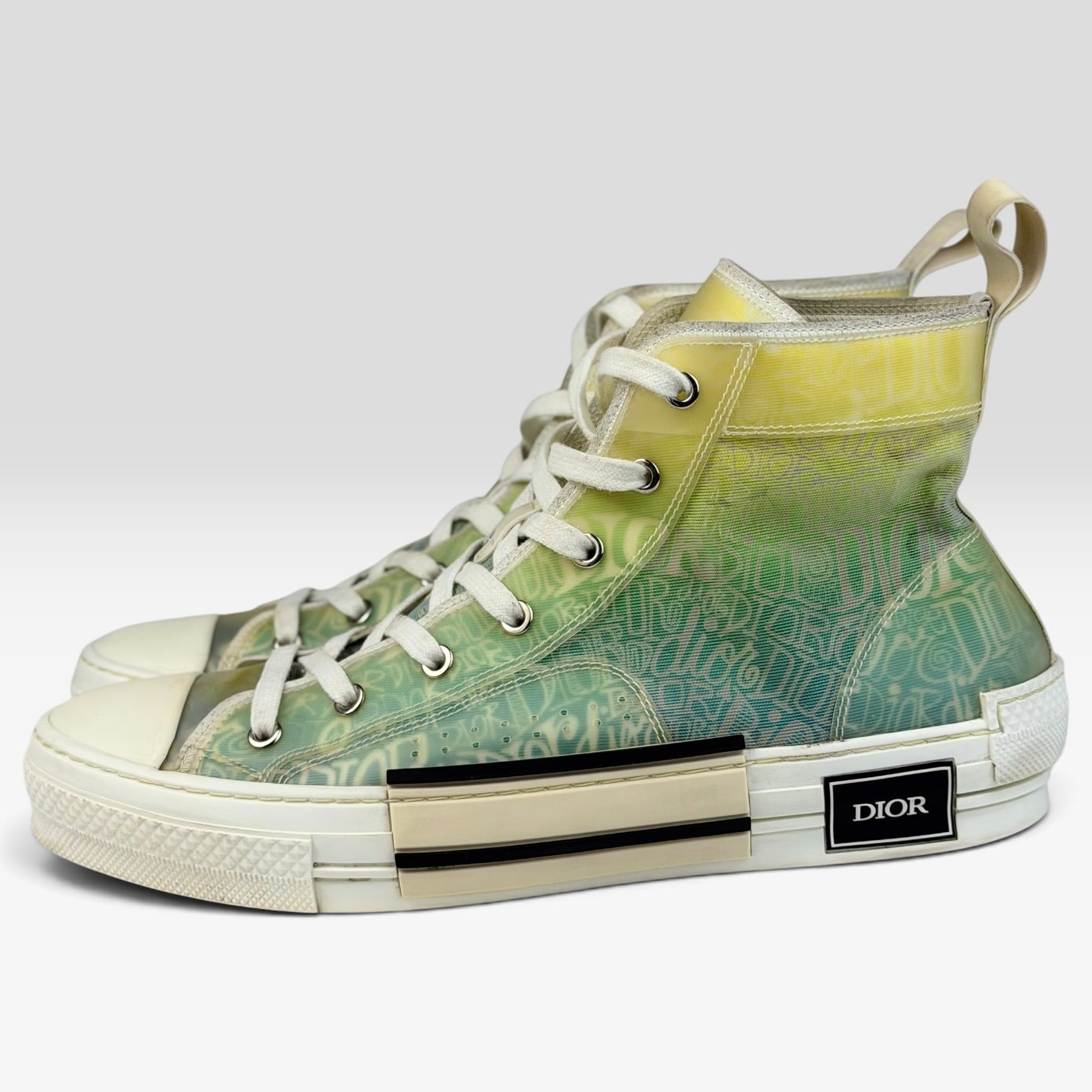 V STEALS Dior x Shawn Stussy B23 high-top sneakers featuring a multicolor gradient canvas with graphic hand-lettering.