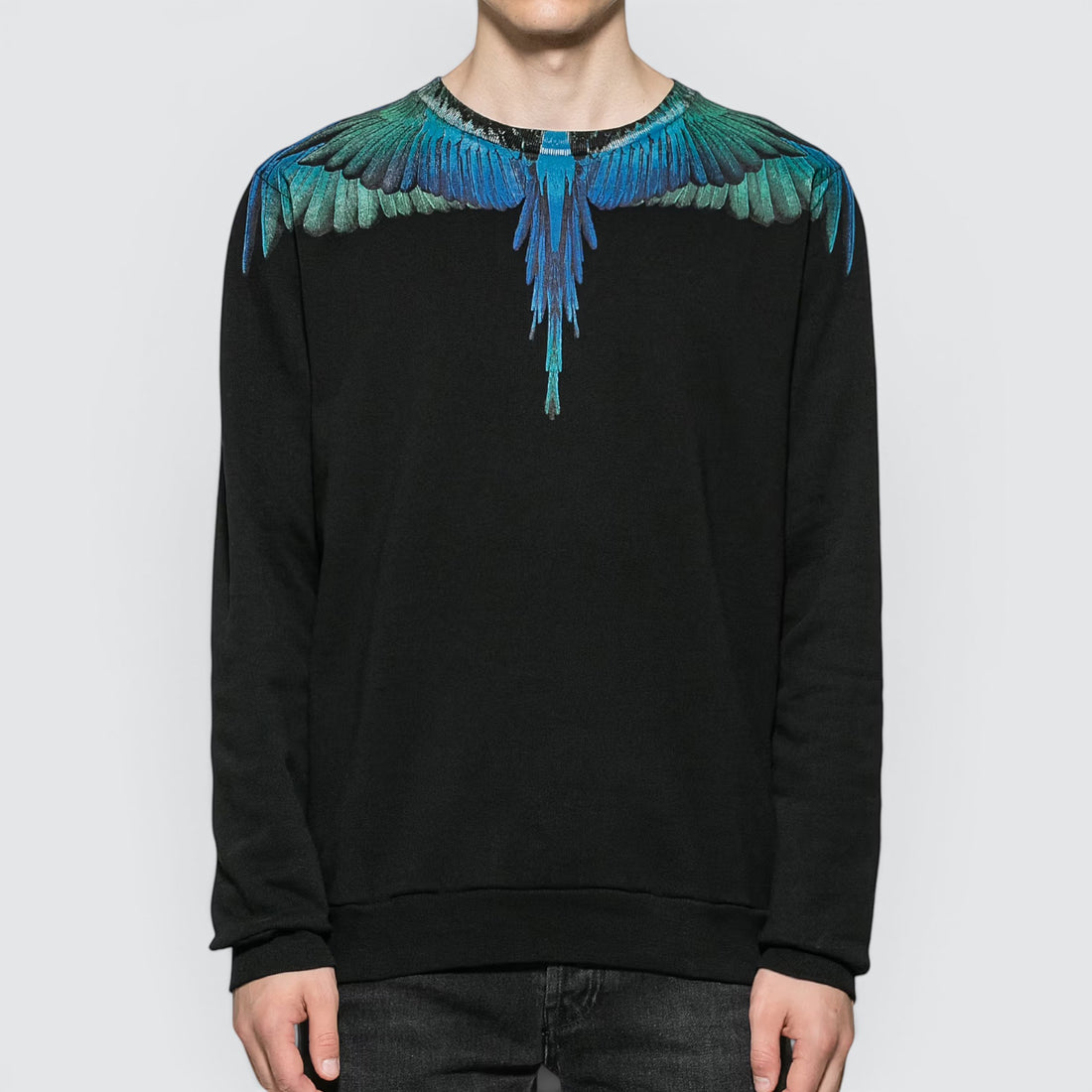 V STEALS Marcelo Burlon black cotton crewneck sweatshirt featuring a blue and green wings graphic print.