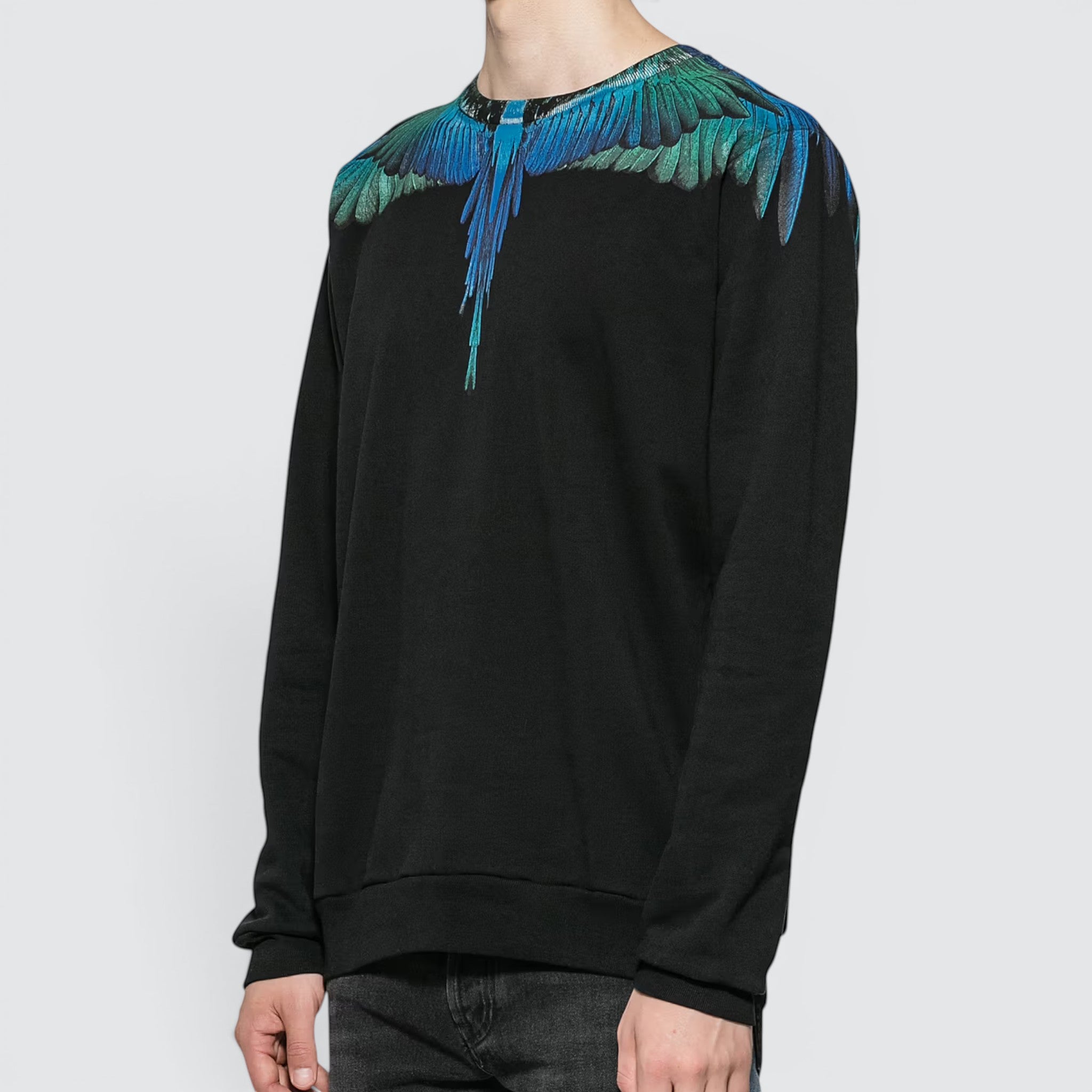 V STEALS Marcelo Burlon black cotton crewneck sweatshirt featuring iconic blue and teal wing graphic print on shoulders.