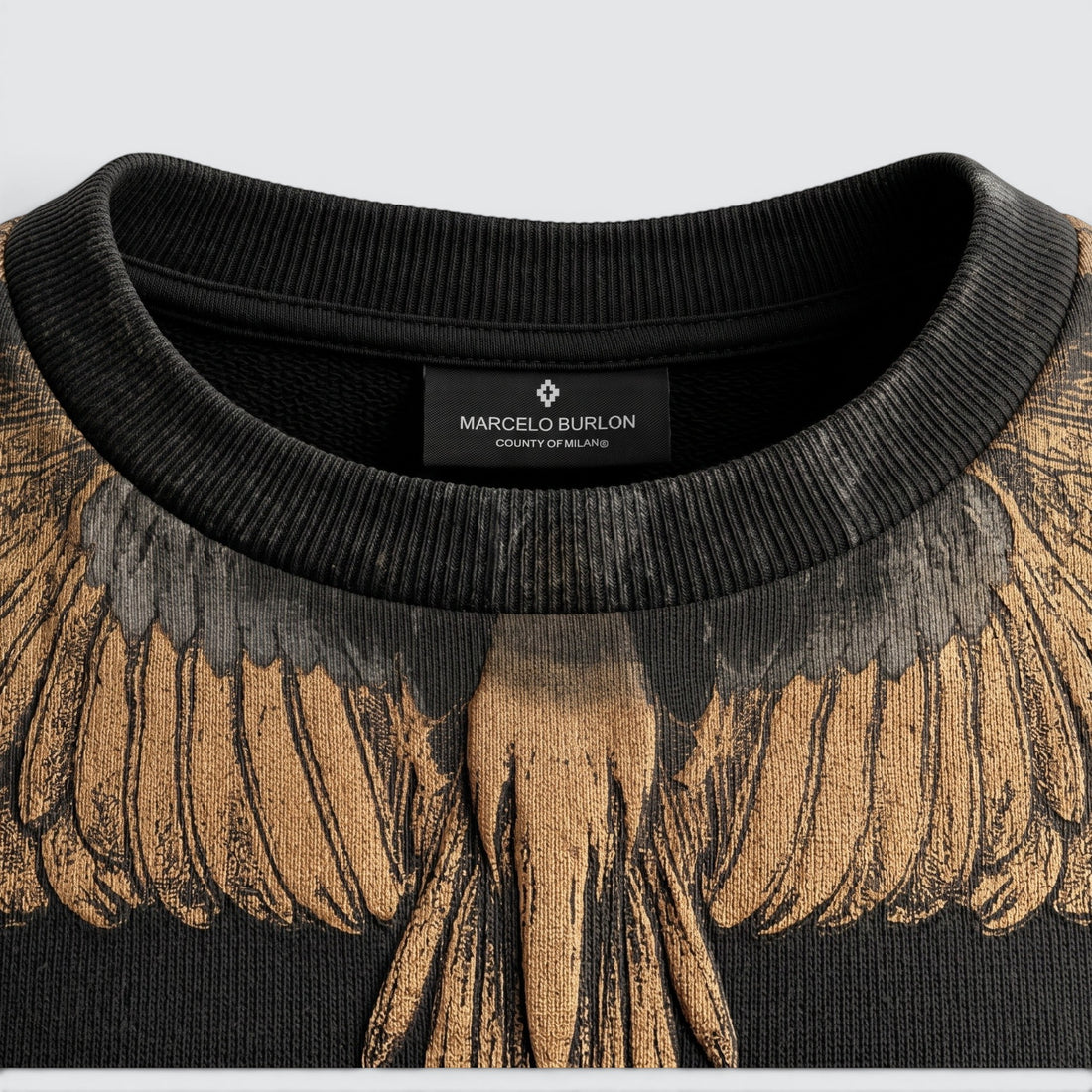 V STEALS Marcelo Burlon black french terry sweatshirt featuring the iconic gold and black wings graphic print