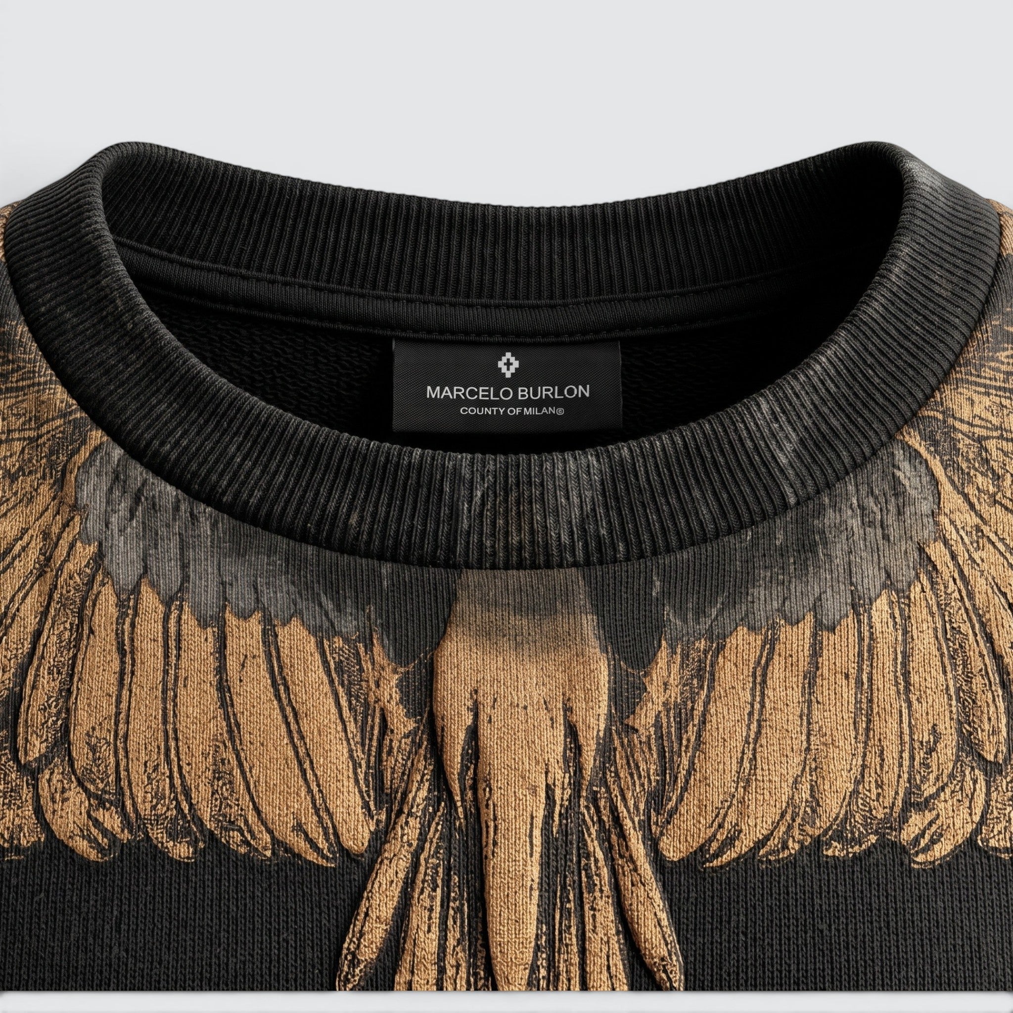 V STEALS Marcelo Burlon black french terry sweatshirt featuring the iconic gold and grey wings graphic print