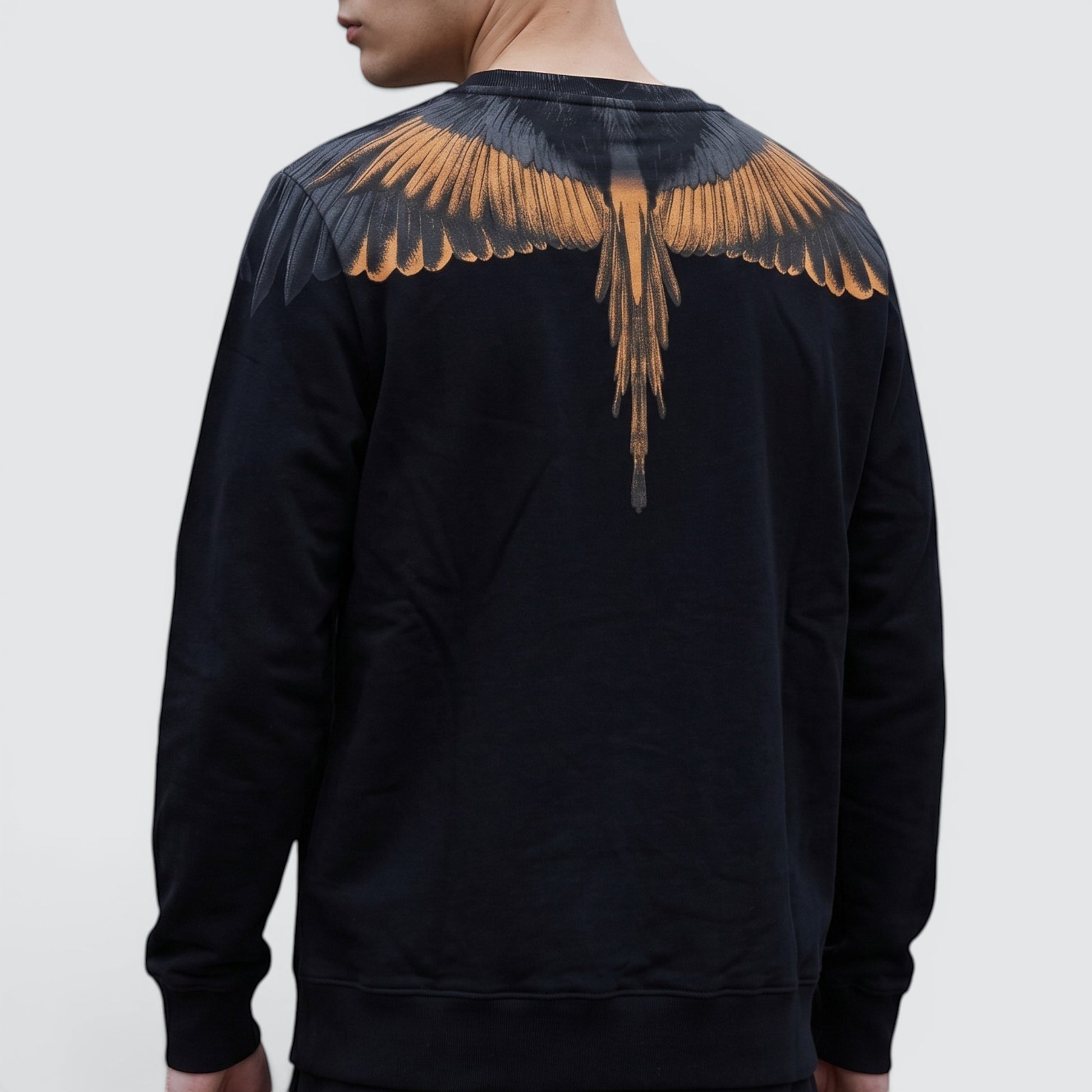 V STEALS Marcelo Burlon black french terry sweatshirt featuring the signature orange and grey wings graphic on back