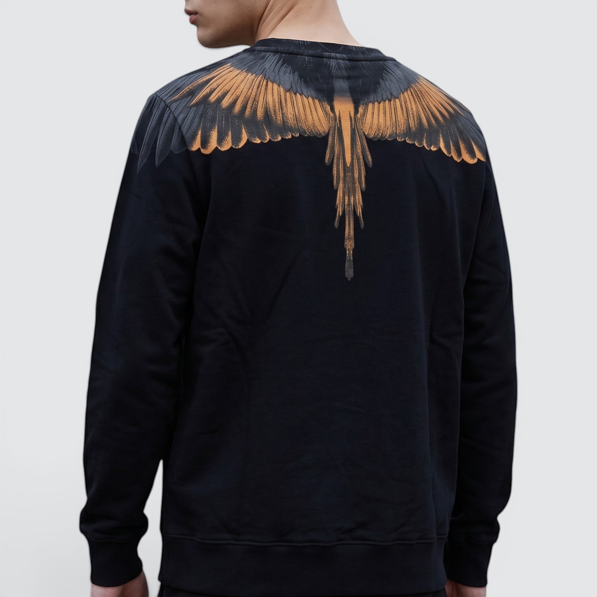 V STEALS Marcelo Burlon black french terry sweatshirt featuring the signature orange and grey wings graphic on back