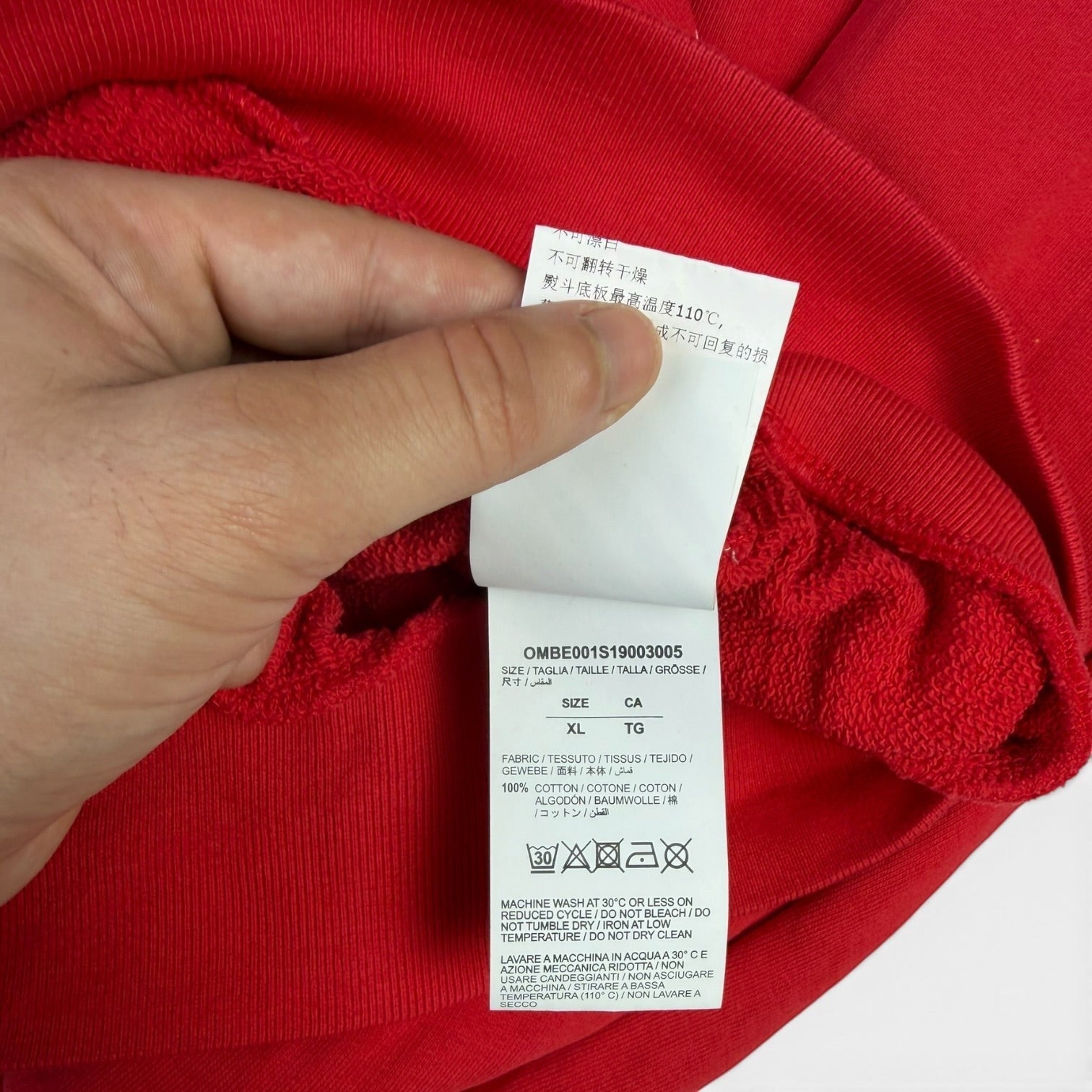 V STEALS Off-White SS18 Mona Lisa hoodie red cotton fabric care label showing size XL and washing instructions