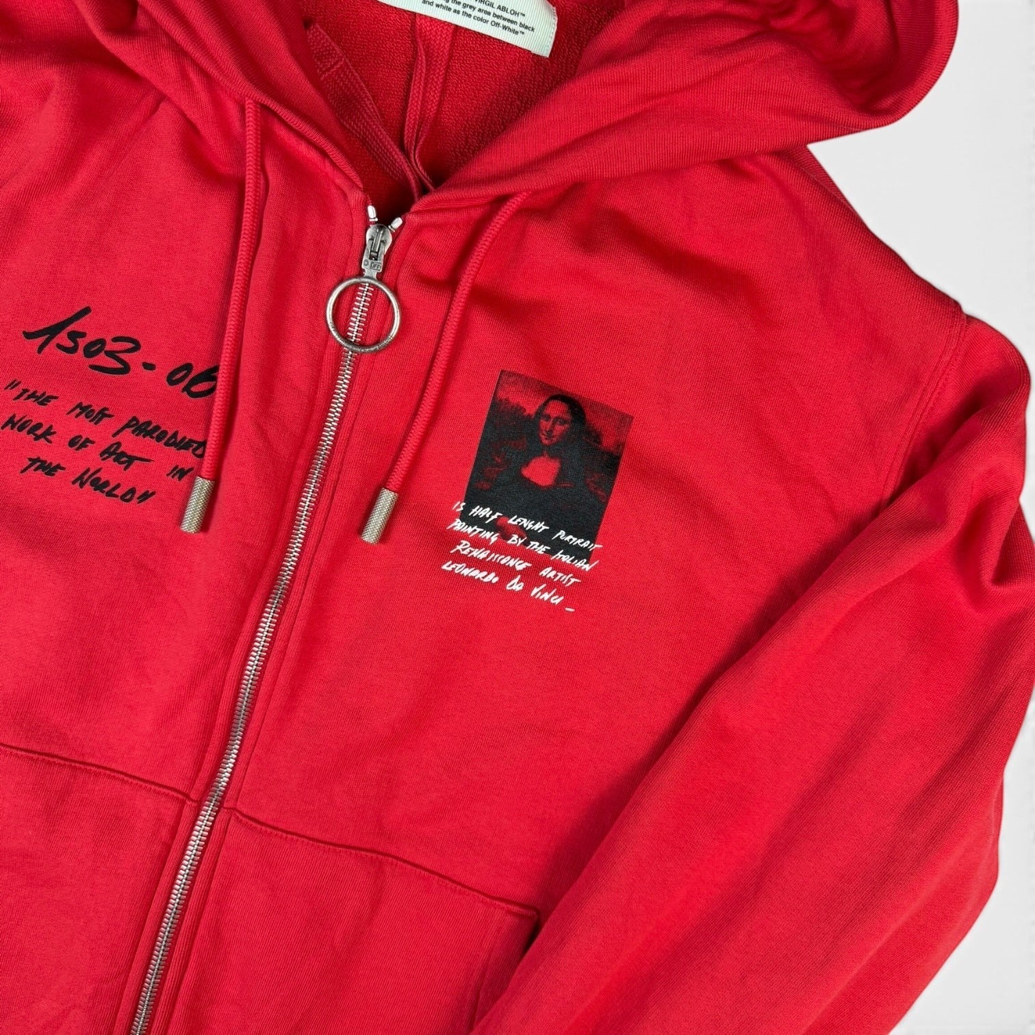 V STEALS red Off-White SS18 Mona Lisa zip hoodie with graphic print, metal ring zipper, and handwritten-style text.