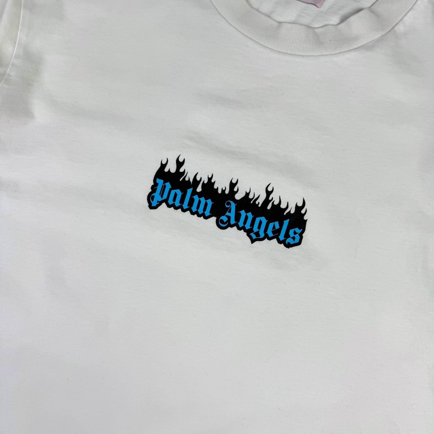 V STEALS white cotton t-shirt featuring a blue gothic Palm Angels logo with black flames on the chest.