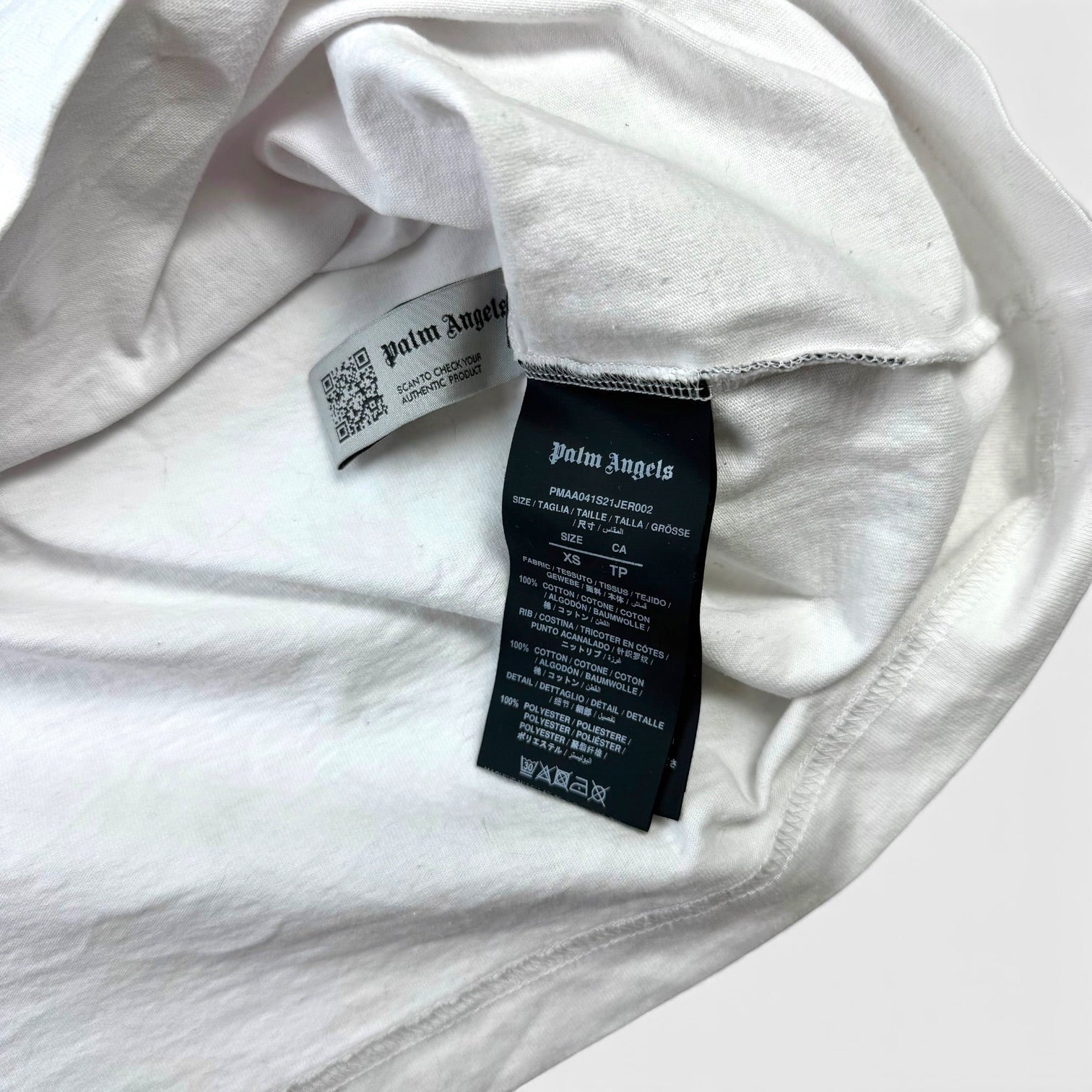 V STEALS Palm Angels white t-shirt interior label showing size XS and fabric composition details