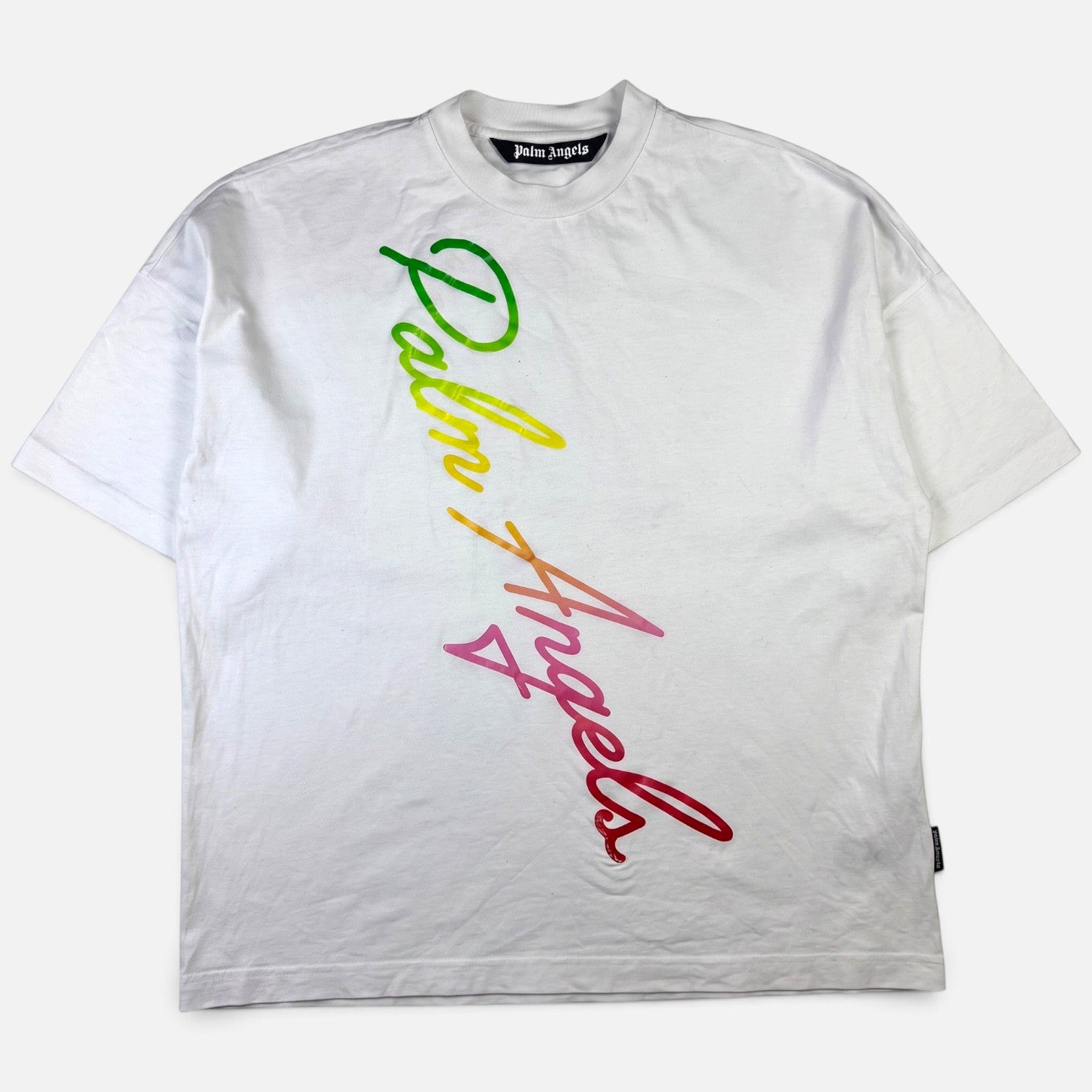 V STEALS white cotton t-shirt with a diagonal multicolored gradient cursive Palm Angels logo across the front.