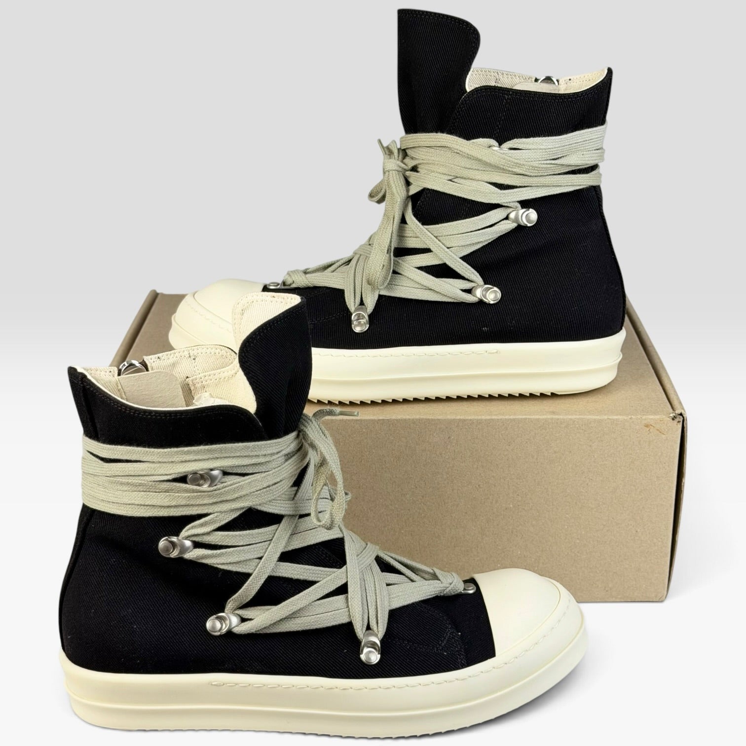V STEALS Rick Owens DRKSHDW black canvas high-top sneakers with megalace hexagram lacing and milk shark-tooth sole.