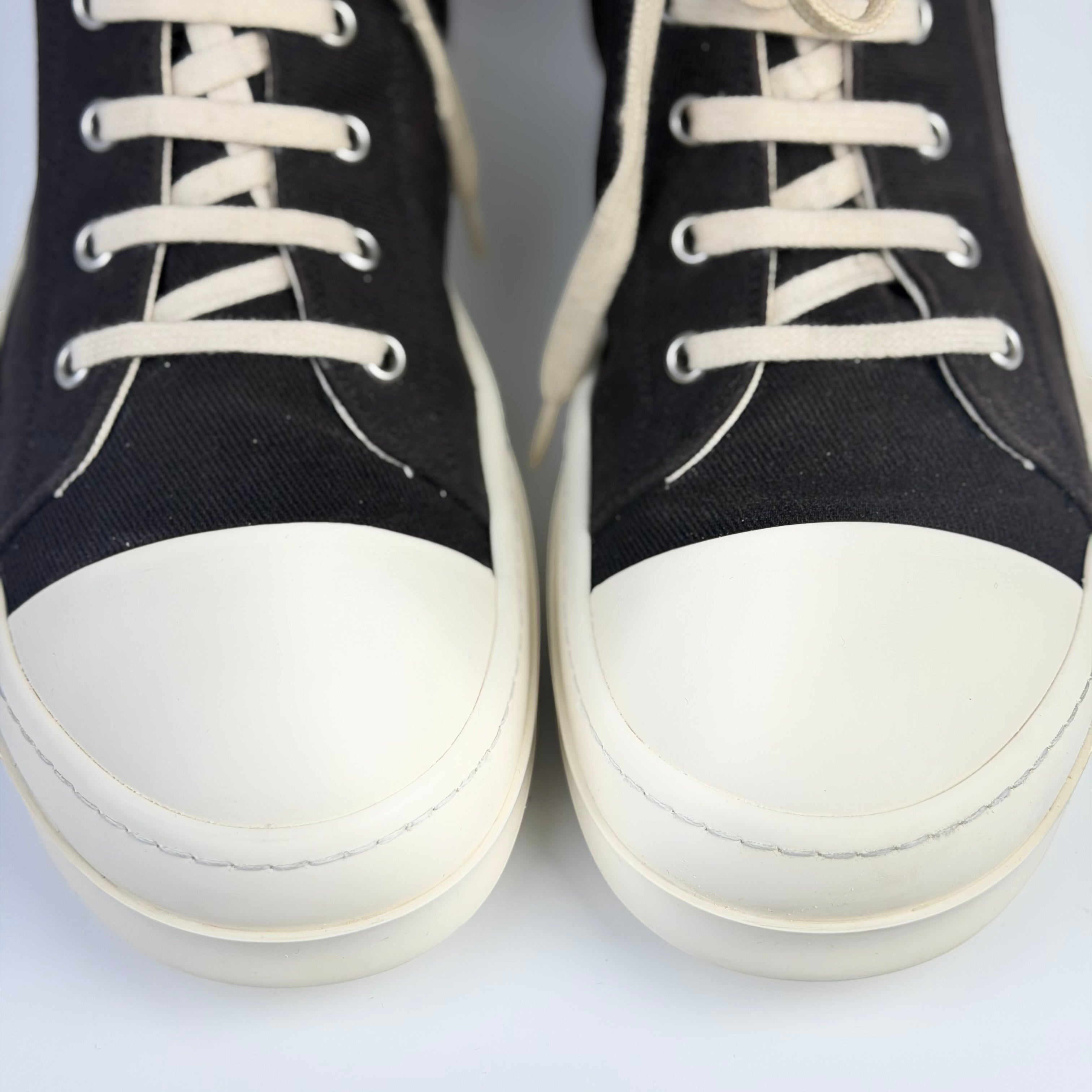 V STEALS Rick Owens Ramones high-top sneakers in black canvas with oversized metal eyelets and white rubber toe caps.