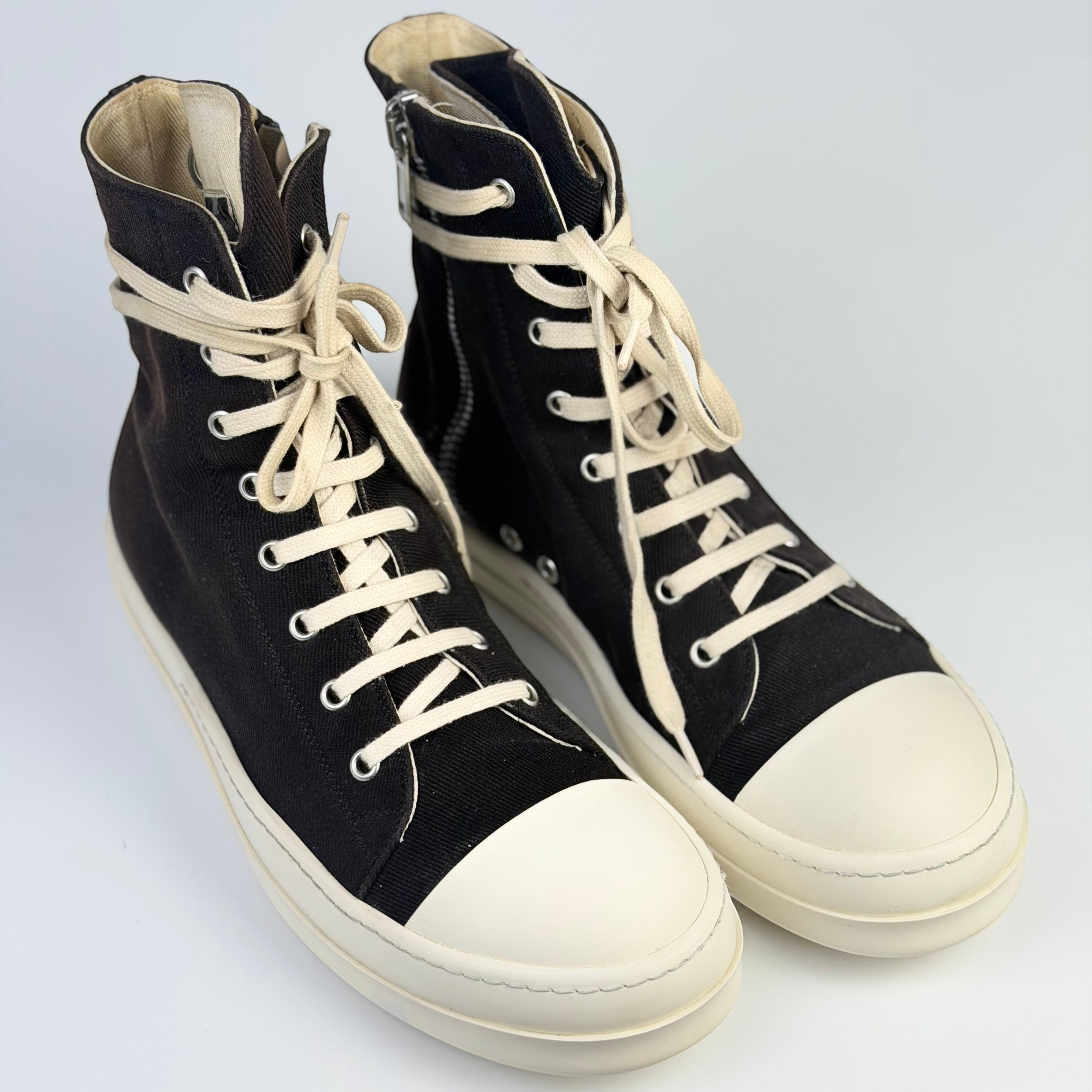 V STEALS Rick Owens Ramones high-top sneakers in black canvas with oversized metal eyelets and white rubber toe caps.